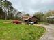 Beautiful home with lush green lawn and mature trees creating a peaceful outdoor setting at 3452 Odell School Rd, Concord, NC 28027