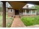 Charming home featuring a welcoming front porch with a brick walkway and well-manicured lawn at 3452 Odell School Rd, Concord, NC 28027