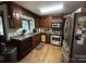 Functional kitchen with wood cabinets, stainless steel appliances, and a sunny window at 3452 Odell School Rd, Concord, NC 28027