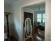 Bright living room featuring hardwood floors and a large window overlooking a treed backyard at 3452 Odell School Rd, Concord, NC 28027