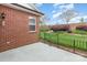 Backyard featuring lawn, small gated fence, brick exterior and lawn at 3921 Sage Ct, Denver, NC 28037