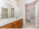 Main bathroom featuring vanity with a long countertop and a shower-tub combo at 3921 Sage Ct, Denver, NC 28037