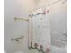 Shower-tub combo with decorative floral curtain and a safety bar at 3921 Sage Ct, Denver, NC 28037