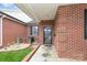 Welcoming brick home entrance featuring a secure door, complemented by a well-kept garden and lawn at 3921 Sage Ct, Denver, NC 28037