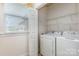 Laundry room with side-by-side washer and dryer, window and wire shelving at 3921 Sage Ct, Denver, NC 28037