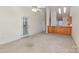 Spacious living room with open access to a kitchen bar, perfect for entertaining and everyday living at 3921 Sage Ct, Denver, NC 28037
