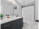 Modern bathroom featuring a sleek vanity with marble countertop and a shower with a curtain at 4012 Flagstone Dr, Lancaster, SC 29720