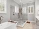 Modern bathroom showcasing glass-enclosed shower, soaking tub, and plantation shutters at 4012 Flagstone Dr, Lancaster, SC 29720