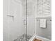 Stylish glass shower featuring subway tile and mosaic flooring, with a window providing natural light at 4012 Flagstone Dr, Lancaster, SC 29720