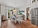 Bright dining area with hardwood floors and a large window that overlooks the landscaped yard at 4012 Flagstone Dr, Lancaster, SC 29720
