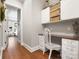 Bright home office featuring white cabinetry, wood countertop, hardwood floors, and natural light at 4012 Flagstone Dr, Lancaster, SC 29720