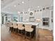 Spacious kitchen features a large island with counter seating, modern appliances and custom cabinetry at 4012 Flagstone Dr, Lancaster, SC 29720