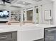 Close up detail of the kitchen showing the sink, faucet, marble counter tops and open concept living at 4012 Flagstone Dr, Lancaster, SC 29720