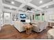 Spacious living room featuring a coffered ceiling, built-in shelves, fireplace, and hardwood floors at 4012 Flagstone Dr, Lancaster, SC 29720