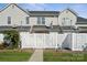 Fenced backyard offering privacy with a white fence and a green lawn, and access to the home at 4211 Center Place Dr, Harrisburg, NC 28075
