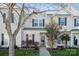 Charming two-story townhouse with well-maintained landscaping and a welcoming entrance at 4211 Center Place Dr, Harrisburg, NC 28075