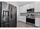 Close up of a kitchen featuring stainless steel appliances, and a gray backsplash at 4211 Center Place Dr, Harrisburg, NC 28075