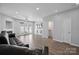 Spacious living room with hardwood floors, a fireplace, and a door leading to the outside at 4211 Center Place Dr, Harrisburg, NC 28075