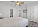 Bright bedroom with hardwood floors, a ceiling fan, and access to the bathroom at 4211 Center Place Dr, Harrisburg, NC 28075