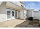Rear patio featuring white doors leading inside the home and a convenient access door at 4211 Center Place Dr, Harrisburg, NC 28075