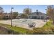 Community pool with a cover, surrounded by lounge furniture and a building with a covered patio at 4211 Center Place Dr, Harrisburg, NC 28075