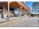 Charming backyard with a paved patio, stone retaining wall, and a comfortable seating area for outdoor relaxation at 428 Pinehaven Dr, New London, NC 28127