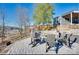 Scenic backyard featuring a stone patio with a fire pit and comfortable seating, perfect for outdoor enjoyment at 428 Pinehaven Dr, New London, NC 28127