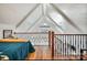 Bedroom features a high vaulted ceiling, a railing and hardwood flooring at 428 Pinehaven Dr, New London, NC 28127