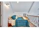Angled bedroom features a full bed, overhead lighting and views of the room's rail at 428 Pinehaven Dr, New London, NC 28127