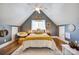 Bedroom features a vaulted ceiling, a ceiling fan and a large bed with modern decor at 428 Pinehaven Dr, New London, NC 28127