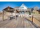 Exterior view from the dock and deck looking toward the lake house at 428 Pinehaven Dr, New London, NC 28127