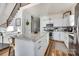 Modern kitchen with granite countertops, white cabinets, stainless appliances and a large center island at 428 Pinehaven Dr, New London, NC 28127