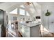 Bright kitchen with vaulted ceilings, stainless steel appliances, a large island, and an open concept to the living area at 428 Pinehaven Dr, New London, NC 28127