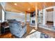 Cozy living room with hardwood floors, a stone fireplace, and comfortable seating at 428 Pinehaven Dr, New London, NC 28127