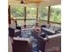 Relaxing screened-in porch with comfortable seating, a hammock, and a scenic lake view, perfect for outdoor living at 428 Pinehaven Dr, New London, NC 28127