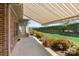 Back patio with a retractable awning, perfect for outdoor dining and relaxation at 489 26Th Ne Ave # C, Hickory, NC 28601