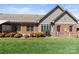 Backyard view with a covered awning and manicured garden, offering a serene outdoor space at 489 26Th Ne Ave # C, Hickory, NC 28601