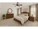Inviting bedroom with a king-sized bed, ceiling fan, and neutral color palette at 489 26Th Ne Ave # C, Hickory, NC 28601