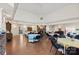 Expansive community room with a fireplace, tables, and a piano at 489 26Th Ne Ave # C, Hickory, NC 28601