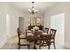 Elegant dining room with a chandelier, hardwood table, and seating for six at 489 26Th Ne Ave # C, Hickory, NC 28601