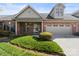 Charming brick home featuring a two-car garage and well-manicured front lawn at 489 26Th Ne Ave # C, Hickory, NC 28601