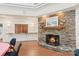 Cozy stone fireplace area with wooden accents, seating and mantelpiece at 489 26Th Ne Ave # C, Hickory, NC 28601