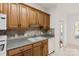 Traditional kitchen with oak cabinets and white appliances, showing ample storage space at 489 26Th Ne Ave # C, Hickory, NC 28601