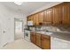 Traditional kitchen with oak cabinets and white appliances; stove, dishwasher, and microwave at 489 26Th Ne Ave # C, Hickory, NC 28601