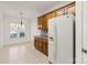 Kitchen showing oak cabinets and a white refrigerator; window provides natural light at 489 26Th Ne Ave # C, Hickory, NC 28601