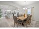 Dining room view into kitchen featuring white cabinets and stainless steel appliances at 5109 Arbordale Way, Mount Holly, NC 28120
