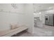 Inviting entryway with bench seating, coat hooks, and views to the kitchen with stainless steel appliances at 5109 Arbordale Way, Mount Holly, NC 28120