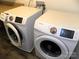 Close-up of modern Samsung washing machines with user-friendly control panels in a laundry room at 5109 Arbordale Way, Mount Holly, NC 28120