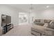 Open-concept living room view into kitchen with stainless steel appliances and modern furniture at 5109 Arbordale Way, Mount Holly, NC 28120