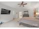 Main bedroom with tray ceiling, TV, ensuite bath and adjoining bedroom at 5109 Arbordale Way, Mount Holly, NC 28120